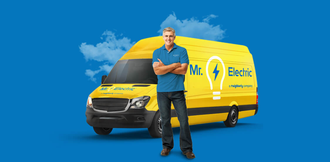 Mr. Electric Employee Standing With Van